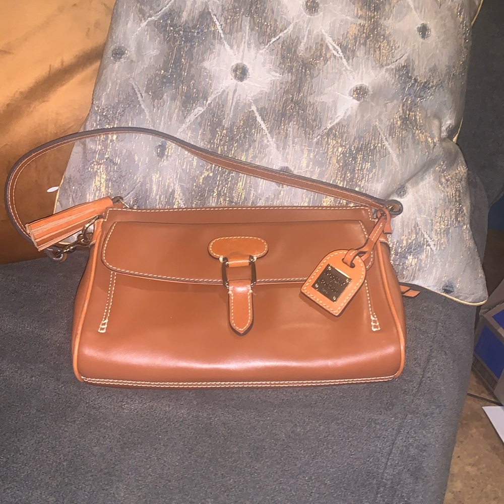 Dooney and Bourke Shoulder bag- great condition- red interior- gold hardware